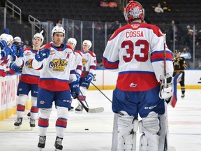 Edmonton Oil Kings forward Dylan Guether it congratulated by goaltender Sebastian Cossa after scoring against the Brandon Wheat Kings at Rogers Place on Saturday, Jan. 15, 2022.