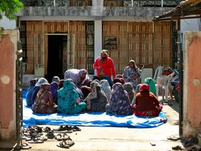 Relatives of Jagdish Baldevbhai Patel, who with his wife and their two children froze to death near the border between the United States and Canada, gather to mourn them at their home in Dingucha village in the western state of Gujarat, India, January 28, 2022.