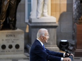 U.S. President Joe Biden speaks in Statuary Hall during a ceremony on the first anniversary of the deadly insurrection at the U.S. Capitol in Washington, D.C., U.S., on Thursday, Jan. 6, 2022.