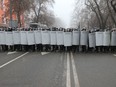 Kazakh law enforcement officers block a street during a protest triggered by fuel price increase in Almaty, Kazakhstan January 5, 2022.