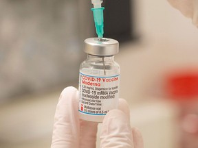 Moderna booster shots come in two strengths — full and half doses.