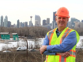 Vern Raincock, director of global sourcing with Alberta Regional Rail, poses in front of the Calgary skyline.