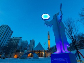 Artwork by Jason Carter called Winter Solstice frames the clock-tower at city hall as temperatures start to cool off again on Sunday, Jan. 2, 2022 in Edmonton. Greg Southam-Postmedia