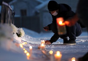 Edmontonians take part in a candle light vigil on the second anniversary of Ukraine International Airlines Flight PS752 being shot down, in Edmonton on Saturday, Jan. 8, 2022. Thirteen Edmontonians were killed in the incident.