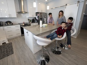 Kevin Lo and Vivian Fung built a new home with Sterling Homes in McConachie Heights so they and their boys Lucas, 3, and Oliver, 7, would have more space to live in.
