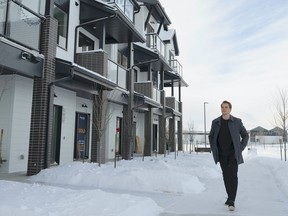 Paul Gazzola goes for a walk outside his Averton townhome in Midtown, St. Albert.