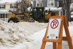 City of Edmonton crews remove snow from the roads in Edmonton's Griesbach neighbourhood on Jan. 21, 2022.