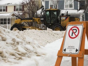 City of Edmonton crews remove snow from the roads in Edmonton's Griesbach neighbourhood on Jan. 21, 2022.