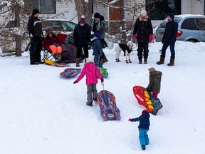 The toboggan hill at Mike Finland Park was busy as the temperature warmed up to a balmy 7C on Sunday, Jan. 2, 2022 in Edmonton. Greg Southam-Postmedia