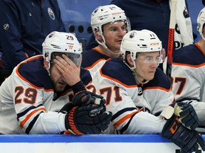 Edmonton Oilers forward Leon Draisaitl (29) and forward Ryan McLeod (71) react after an empty net goal by the Toronto Maple Leafs during the third period at Scotiabank Arena on Jan. 5, 2022.