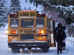 Students at Austin O'Brien High School head back to school on Monday, Jan. 10, 2022, after their Christmas break was extended by a week due to the Omicron virus.