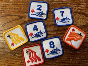 Red Cross swim badges.