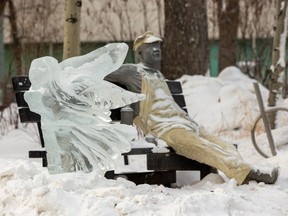 An ice sculpture stands in front of the Lunchbreak sculpture in Churchill Square as the temperature held at – 25 C on Saturday, Jan. 1, 2022 in Edmonton. Greg Southam-Postmedia