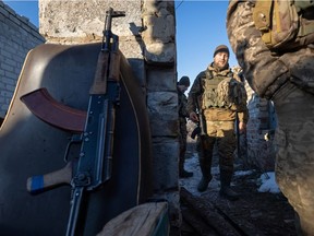 Service members of the Ukrainian armed forces are seen at combat positions near the line of separation from Russian-backed rebels near Horlivka in Donetsk Region, Ukraine, January 8, 2022. Picture taken January 8, 2022. REUTERS/Andriy Dubchak