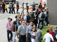 With long-term unemployment on the rise, we need a new approach to put Albertans back to meaningful work, says writer Adam Legge, president of the Business Council of Alberta. Hundreds of people line up outside a Calgary hotel on Aug. 17, 2016, during the Calgary Airport Authorities job fair.