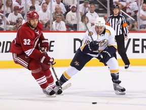 Brandon Yip #18 of the Nashville Predators skates with the puck past Michal Rozsival #32 of the Phoenix Coyotes in Game One of the Western Conference Semifinals during the 2012 NHL Stanley Cup Playoffs at Jobing.com Arena on April 27, 2012 in Glendale, Arizona.