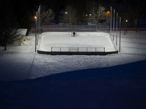 A solitary hockey player skates at the Cloverdale Community League outdoor rink, 9411 97 Ave., in Edmonton on Monday Jan. 31, 2022.