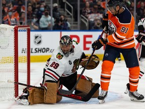 Edmonton Oilers’ Evander Kane (91) battles Chicago Blackhawks’ goaltender Marc-Andre Fleury (29) during third period NHL action at Rogers Place in Edmonton, on Wednesday, Feb. 9, 2022. Photo by