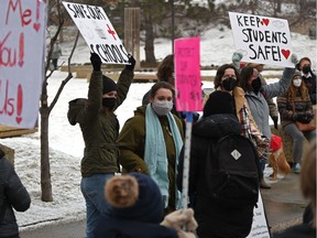 Students in favour of wearing masks in school held a rally near the Alberta legislature, on Feb. 14, 2022.