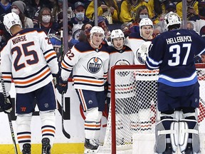 Edmonton Oilers right wing Kailer Yamamoto (56) celebrates his second period goal on Winnipeg Jets goaltender Connor Hellebuyck (37) at Canada Life Centre on Feb. 19, 2022.
