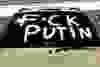A F*ck Putin sign is seen in a parking lot as local Ukrainians gather demonstrate their support for family and friends in Ukraine and here at home during the invasion of the European country by Russia during a rally at the Alberta Legislature in Edmonton on Thursday, Feb. 24, 2022.
