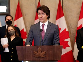 Canada's Prime Minister Justin Trudeau comments on the ongoing truckers mandate protest during a news conference on Parliament Hill in Ottawa, Canada on February 14, 2022.