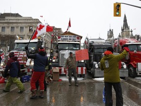 Protesters from the "Freedom Convoy" in front of Parliament Hill during a demonstration in Ottawa, Ontario, Canada, on Thursday, Feb. 3, 2022.