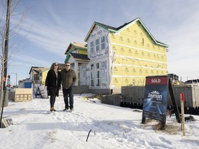 Pamela and Paul Anderson go for a walk near their new home in Desrochers Villages.