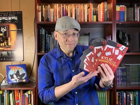 Marty Chan holds copies of his most recent book, Kylie the Magnificent, which was released in December.