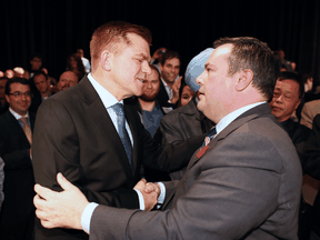 Jason Kenney shakes hands with Brian Jean after it was announced that Kenney was elected leader of the United Conservative Party. The leadership race winner was announced at the BMO Centre in Calgary on Oct. 28, 2017.