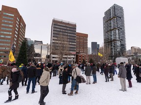 Protesters against COVID restrictions gather at Central Memorial Park near Sheldon M. Chumir Centre on Saturday, Dec. 18, 2021.