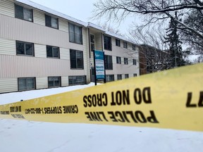 ASIRT is investigating a police shooting that killed two people on Wednesday, Feb. 23, 2022, in Edmonton. Police tape restricts access to a walk up apartment near 107 Avenue and 105 Street on Thursday, Feb. 24, 2022.