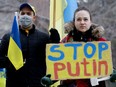 Edmontonians take part in a rally in support of Ukraine, organized by the Ukrainian Students' Society (USS) at the University of Alberta in Edmonton, on Monday Feb. 28, 2022.