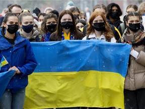 Edmontonians take part in a rally in support of Ukraine, organized by the Ukrainian Students' Society (USS) at the University of Alberta in Edmonton, on Monday Feb. 28, 2022.