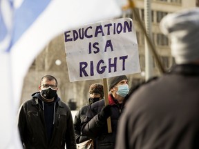 Approximately three dozen representatives from post-secondary unions, organizations and supporters gather in solidarity of striking University of Lethbridge faculty in Violet King Henry Plaza, on the Alberta Legislative grounds, in Edmonton on Friday Feb. 11, 2022.