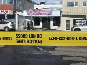 Police tape cordons off 118 Avenue near 125 Street in Edmonton on Saturday, March 12, 2022. One man was killed and six others injured in a shooting that happened outside the lounge.