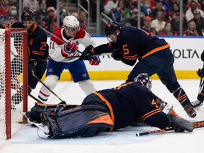 Edmonton Oilers’ goaltender Mike Smith (41) stops Montreal Canadiens’ Brendan Gallagher (11) during second period NHL action at Rogers Place in Edmonton, on Saturday, March 5, 2022.