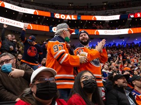 Fans celebrate a goal from Edmonton Oilers’ Ryan McLeod (71) on Montreal Canadiens’ goaltender Sam Montembeault (35) during second period NHL action at Rogers Place in Edmonton, on Saturday, March 5, 2022.