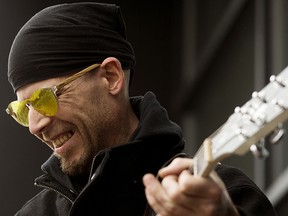 Electric guitarist Chad Madison busks along Whyte Avenue near 104 Street, in Edmonton, on Tuesday March 15, 2022.