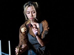 Zoei Nicole Boncocan performs as Ash Girl during St. Joseph High School's production of The Ash Girl in Edmonton, on Wednesday, March 16, 2022.
