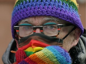 Michael Phair peers through his foggy eyeglasses at Michael Phair Park in downtown Edmonton on Tuesday, March 8, 2022, where the Edmonton Queer History Project launched a new downtown map, walking tours, interactive multi-media website, and podcast to help document and celebrate Edmonton's rich and diverse LGBTQ2+ history.