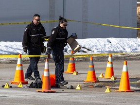 Police investigate a mass shooting near 118 Avenue and 125 Street on Saturday, March 12, 2022, that left one man dead and six others in hospital.