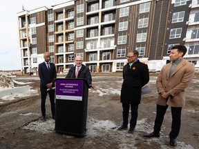 Housing and Diversity and Inclusion Minister  Ahmed Hussen, left, Tourism Minister and Edmonton Centre MP Randy Boissonnault, Edmonton Mayor Amarjeet Sohi, and David Mitton, president of Leston Holdings (1980) Ltd., announce the Heritage Flats project, that includes 102 affordable housing units for members of Enoch Cree Nation, in southwest Edmonton on March 15, 2022.