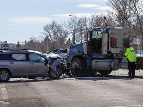 Police investigate a collision involving a semi truck carrying a load of metal pipe, and a SUV at the intersection of Millbourne Road East and 76 Street on Monday,March 21, 2022 in Edmonton.  

Greg Southam-Postmedia