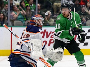 Edmonton Oilers goaltender Mikko Koskinen (19) makes a pad save as Dallas Stars center Joe Pavelski (16) looks for the rebound at American Airlines Center on Tuesday, March 22, 2022.