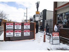 Four businesses on 118 Avenue have seen their revenue almost 100 per cent disappear due to street frontage and signage completely blocked off by fencing.