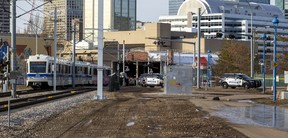 Police tape surrounds an area near the LRT crossing on 95 Street near 105 Avenue on Friday, March 25, 2022 in Edmonton.–