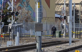 Police tape surrounds an area near the LRT crossing on 95 Street near 105 Avenue on Friday, March 25, 2022 in Edmonton.