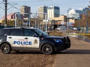 Police tape surrounds an area near the LRT crossing on 95 Street near 105 Avenue on Friday, March  25, 2022 in Edmonton.
