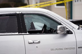 A bullet hole and shattered window in a truck parked in the driveway of a residential home located at 374 Heath Road in the southwest Edmonton neighborhood of Riverbend on Monday March 14, 2022, where police are investigating a shooting.